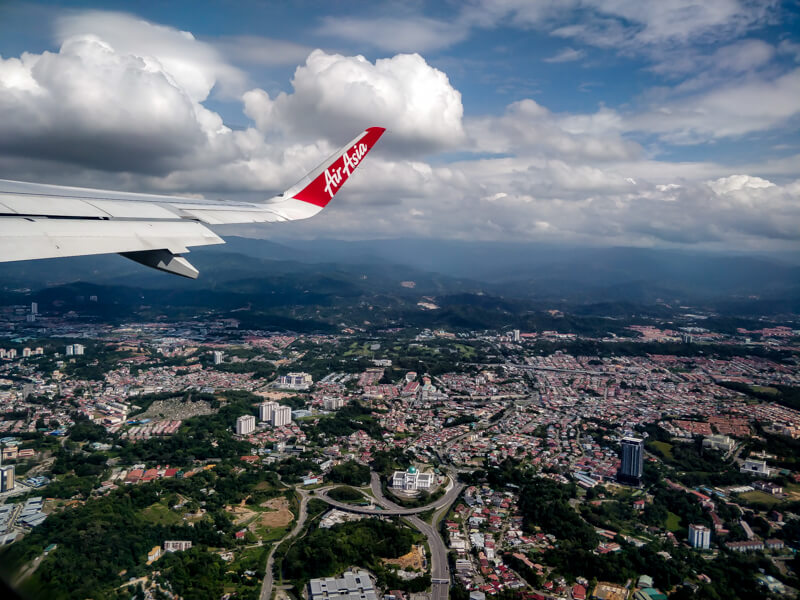 a plane flying over malaysia