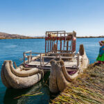 a child on a reed island on Islas_flotantes_de_los_Uros Lago Titicaca Perú