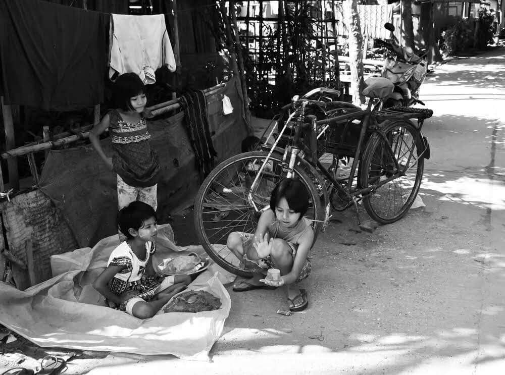 Riding the Yangon Circular train – Myanmar Memoirs 35 children playing with bicycles and trishaw in mingaladon.jpeg