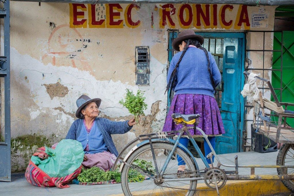 peruvian ladies observing local life top things to do in peru