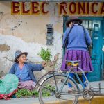 peruvian ladies observing local life top things to do in peru