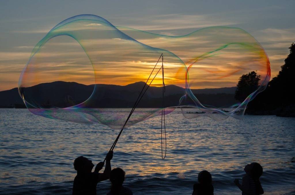 people having at the beach blowing big sized bubbles.jpg