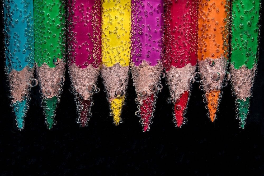 blurred pencils colorful in water used in an article on creative schedules