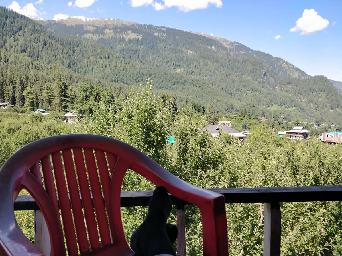 Homestays in India – Pros and Cons, Tips, and Tried Homes 2 1 / 1 – enjoying view from my india homestays in kalga himachal.jpg