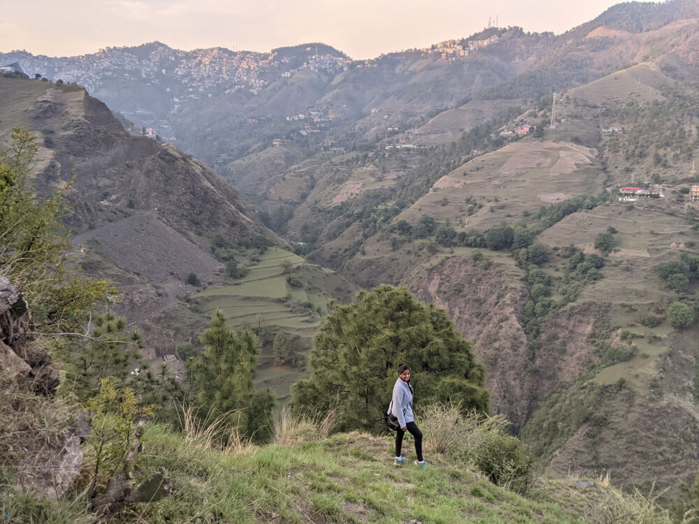 standing at the edge of mehli himalaya mountains shimla