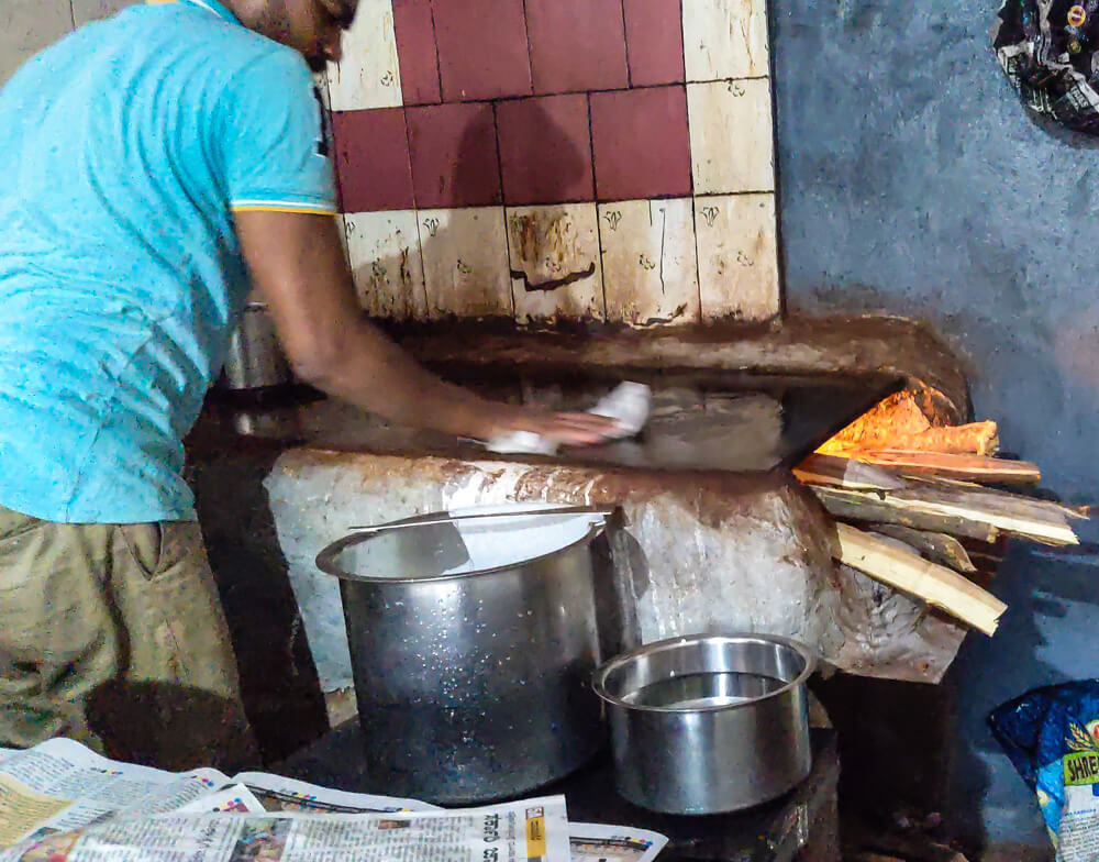 wiping the iron surface clean for davanagere benne dosa karnataka