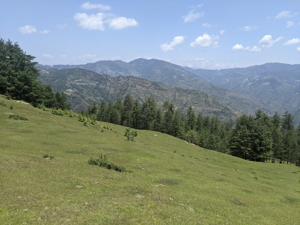 rolly polly pastures and the hills beyond