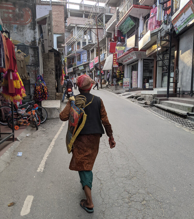 local villager going to shop in karsog market