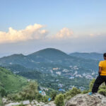the author standing on a hill in himachal pradesh looking at the view to show we are tiny in the spectrum of things 2.jpg
