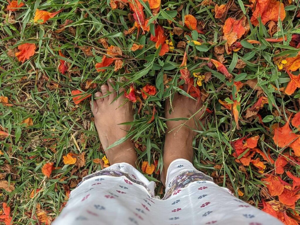 5 Years of On My Canvas: What I've Learned 4 writer with her feet on the ground patted with flowers 5 years of on my canvas personal growth and travel blog