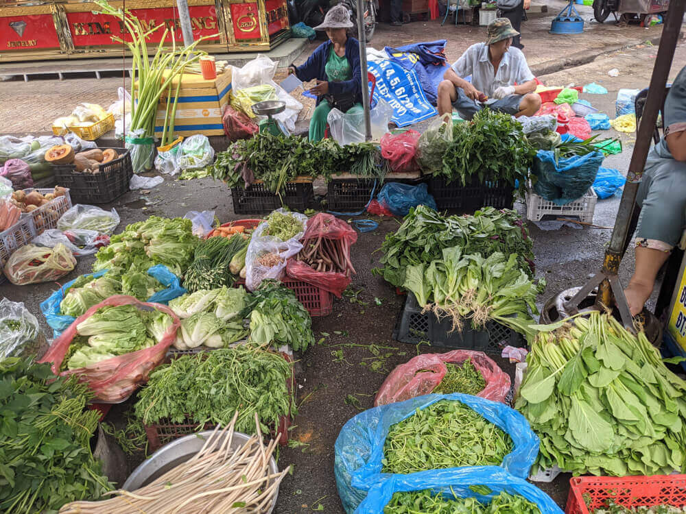 the insane amount of greens Vietnamese eat at a local street market in ho chi minh city saigon vietnam