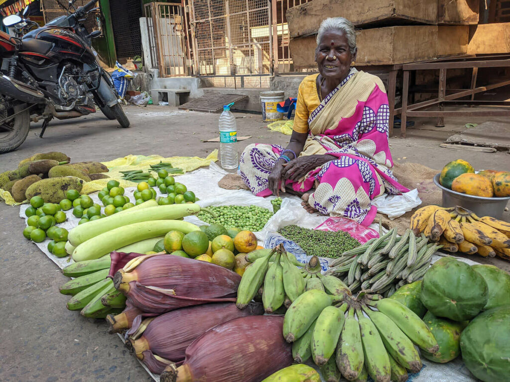 an old pondicherry woman selling greens on pondicherry streets tiny