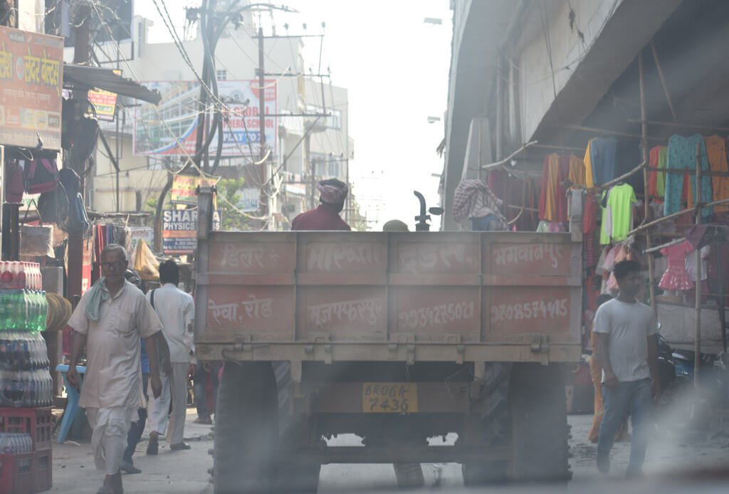 dusty frames driving behind a lorry in bihar