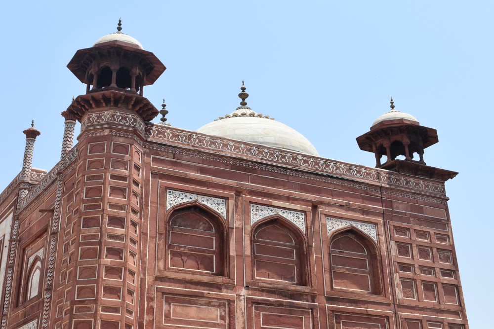 a close up of the red standstone mosque