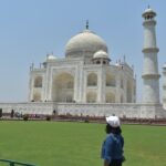 admiring the taj mahal in bright daylight in agra