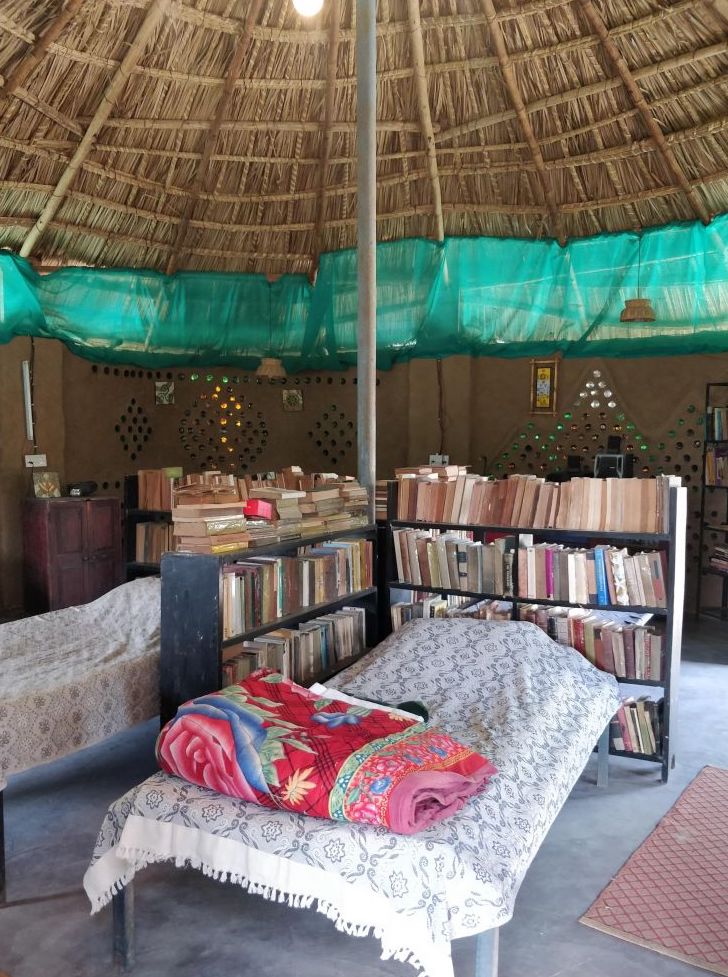 my kind of dorm, a bed surrounded by books in a dorm room in rajasthan