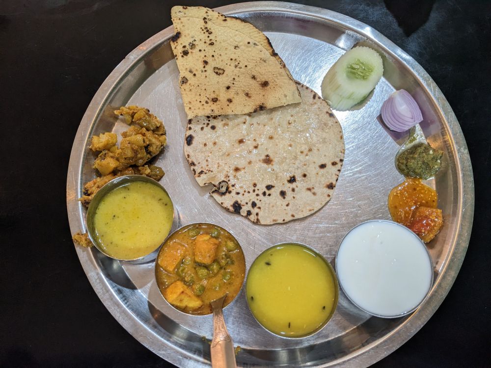 a simple thali in gangtok sikkim multiple curreis roti papad curd pickle another moment of bliss
