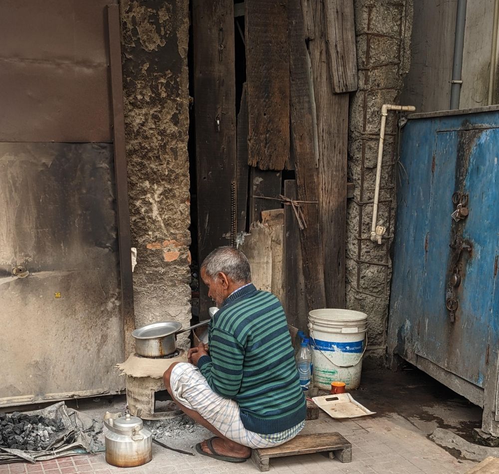 a tea seller on the roadside, the photo tells many stories