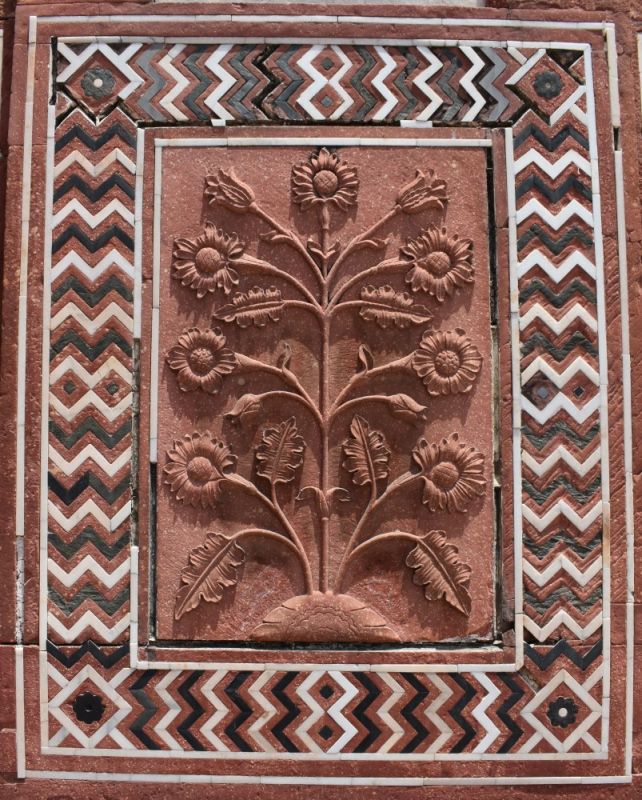 _flower carvings in stone on the mosque of taj mahal