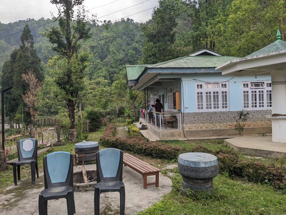 the house the outside seating of a tea estate cottage in eastern himalayas