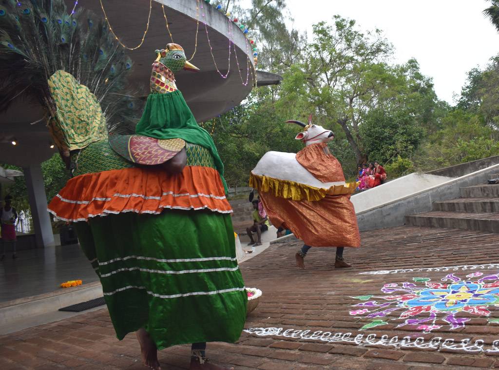 tamil dance Mayilattam performed by two men dressed as bull and peacock