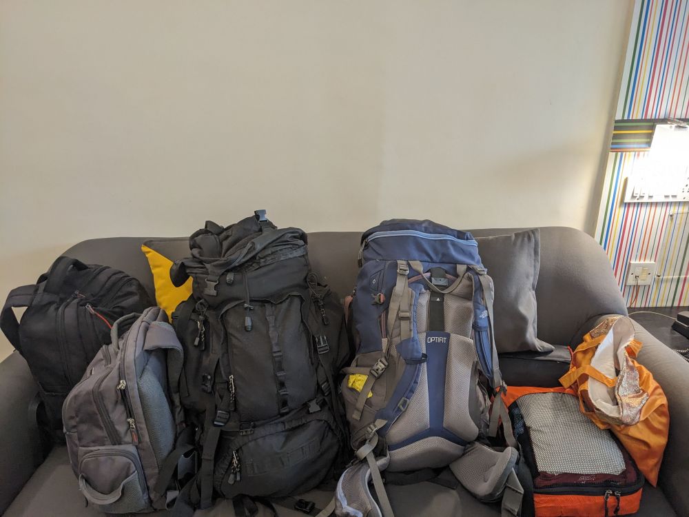 multiple bags on a sofa