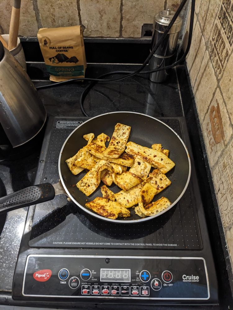 making paneer grilled on a small induction in goa home