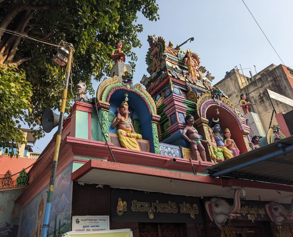 a colorful temple in mysore with deities and gods on walls (1)