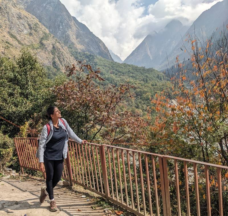 nothing like the mountains, all the sunsets are now worth waiting for. trees, fall colors, mountains, open sky. a girl standing in a beautiful scene himalayas uttarakhand valley of flowers