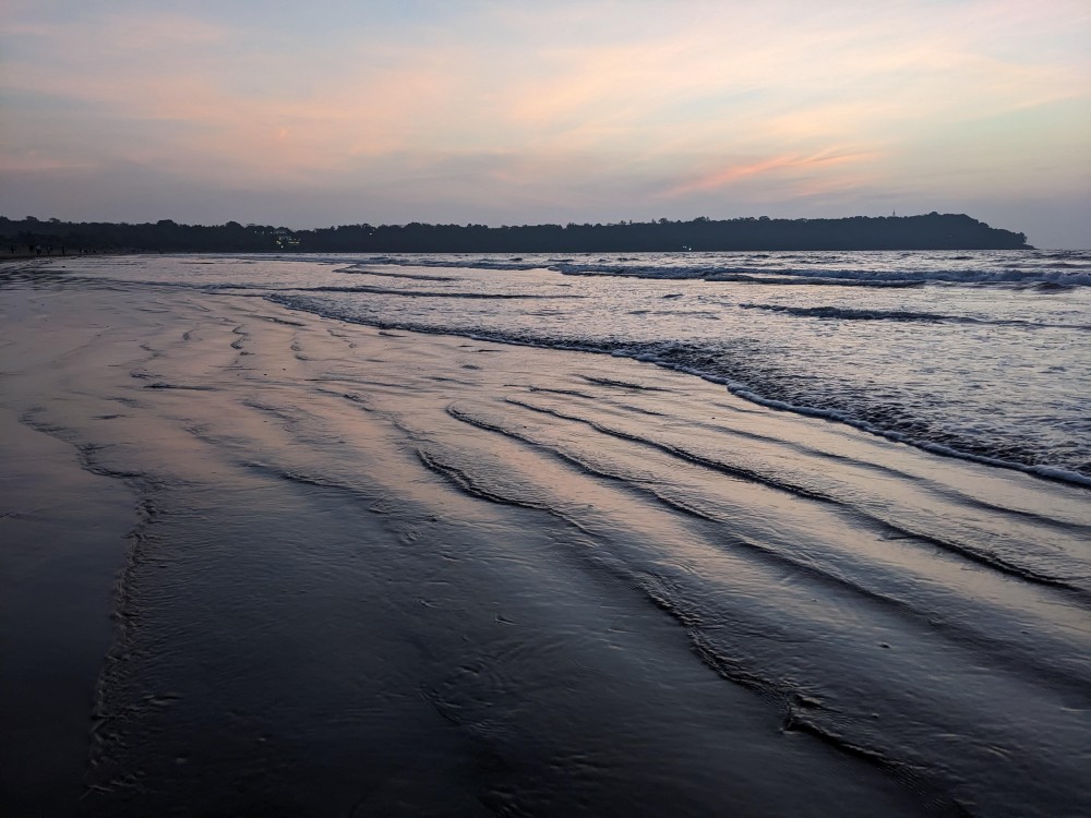 the open sea beach blue waves orange sunset hues goa