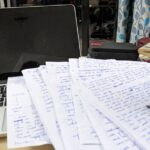 writing with hand papers with lot of ink writing ink pot computer