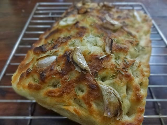 My Love and Hate Relationship With Food: Creating Extraordinary 2 a freshly baked bright focacia bread with garlic cloves on it