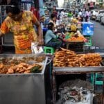 yangon street food fried snacks fritters a woman burmese