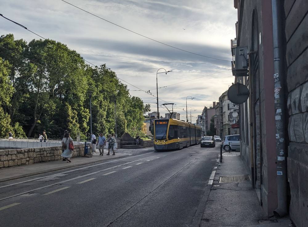 Sauntering Along Sarajevo, Bosnia and Herzegovina: An Unusual Travel Guide 3 the tram in sarajevo buildings road as image for best things to see in sarajevo city
